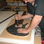 Flamed redwood top being fitted to Korina body